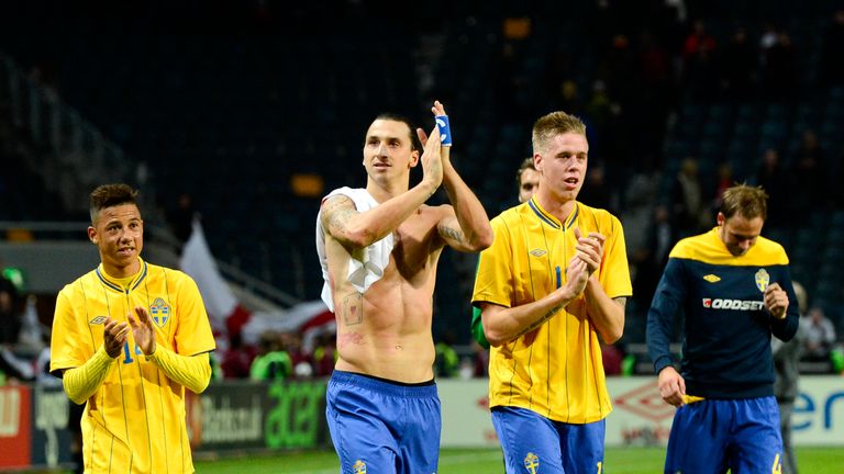 Sweden's midfielder Tobias Sana (L), striker and team captain Zlatan Ibrahimovic (2nd-L) and defender Pontus Jansson react at the end of the FIFA World Cup