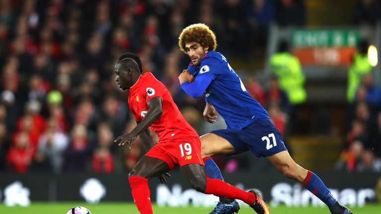 Sadio Mane takes on Marouane Fellaini in the first half at Anfield