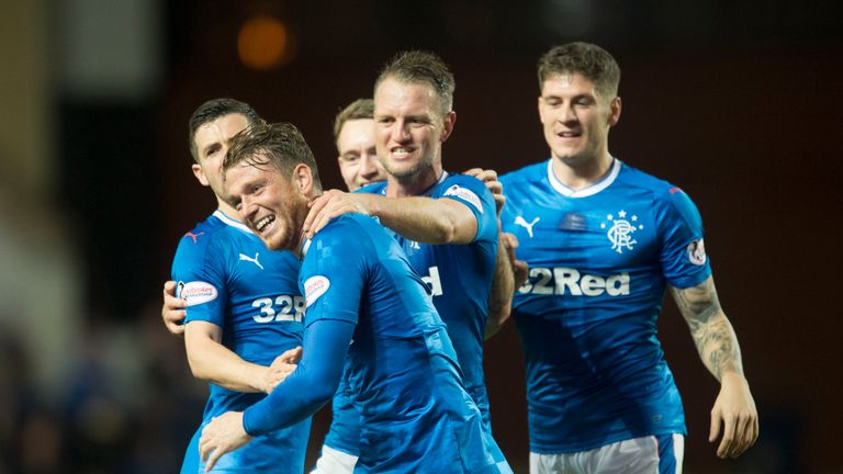 Rangers' Joe Garner celebrates with team-mates after equalising for the hosts
