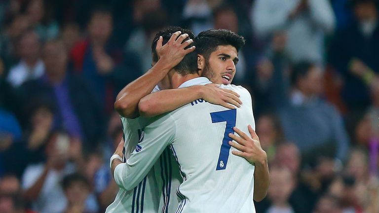 Jese (L) of Real Madrid celebrates scoring his team's third goal against Legia Warsaw with his team mate Cristiano Ronaldo 