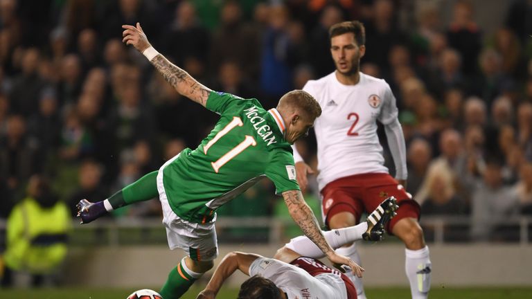 James McClean of Republic of Ireland is tackled by Guram Kashia of Georgia during theWorld Cup Group D Qualifier