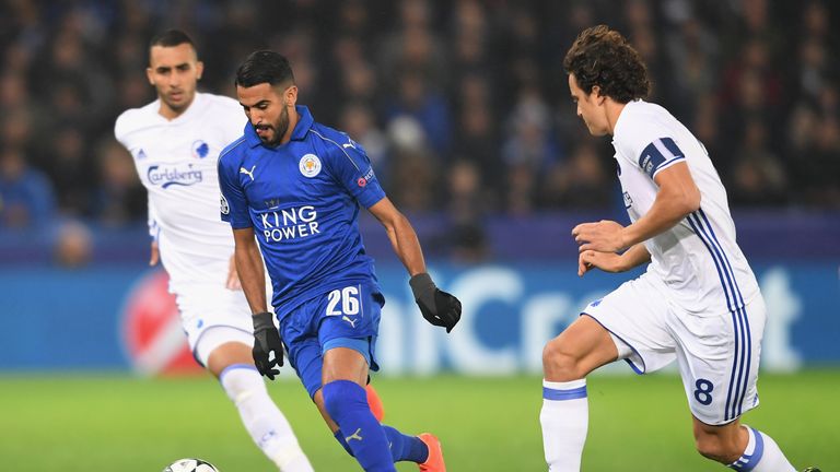 LEICESTER, ENGLAND - OCTOBER 18: Riyad Mahrez of Leicester City and Thomas Delaney of FC Copenhagen compete for the ball during the UEFA Champions League G