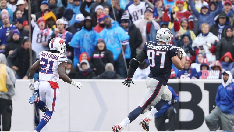 Rob Gronkowski #87 of the New England Patriots runs for a touchdown after the catch against the Buffalo Bills during the first 