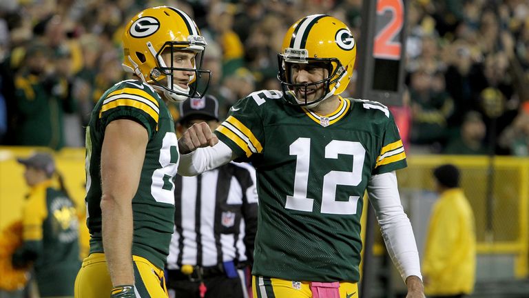 GREEN BAY, WI - OCTOBER 09:  Jordy Nelson #87 and Aaron Rodgers #12 of the Green Bay Packers celebrate after scoring a touchdown in the first quarter again