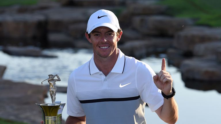 DUBAI, UNITED ARAB EMIRATES - NOVEMBER 22:  Rory McIlroy of Northern Ireland celebrates with the Race to Dubai Trophy after the final round of the DP World