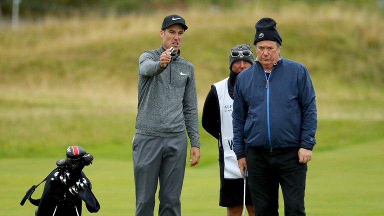 ST ANDREWS, SCOTLAND - OCTOBER 07:  Ross Fisher of England with playing partner Anthony Wreford the 17th green  during the second round of the Alfred Dunhi