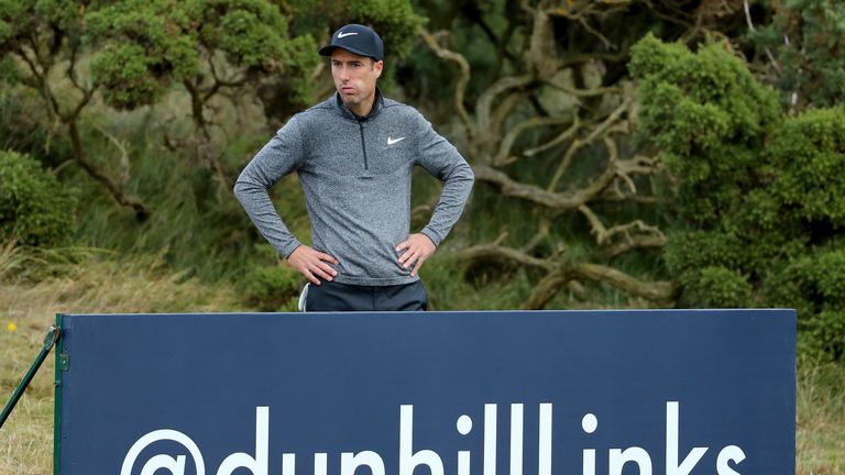 ST ANDREWS, SCOTLAND - OCTOBER 09:  Ross Fisher of England accesses his shot behind a board on the 12th hole during the final round of the Alfred Dunhill L