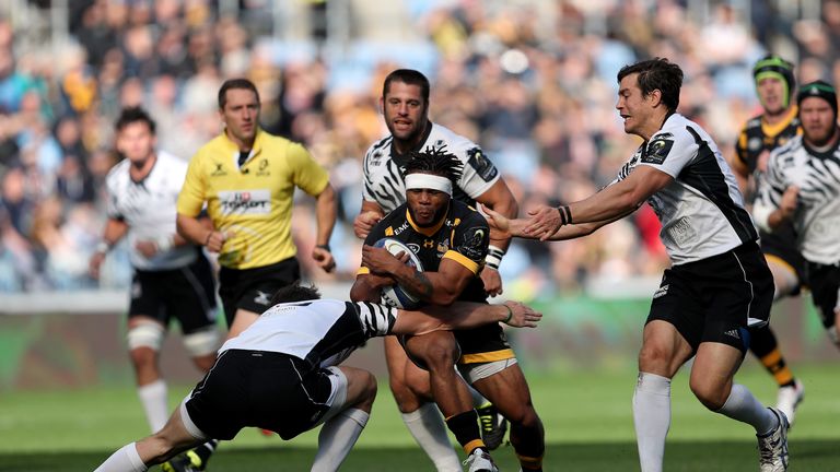 Kyle Eastmond is tackled by Zebre's Edoardo Padovani