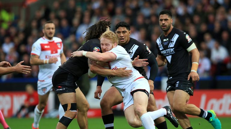 England's James Graham  charges into Tohu Harris 