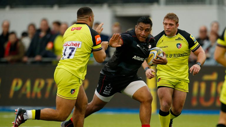 Mako Vunipola is challengd by Leicester's Tom Youngs (right) and Ellis Genge