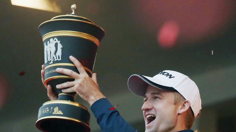SHANGHAI, CHINA - NOVEMBER 08:  Russell Knox of Scotland hoists the trophy after his two-stroke victory at the WGC - HSBC Champions at the Sheshan Internat