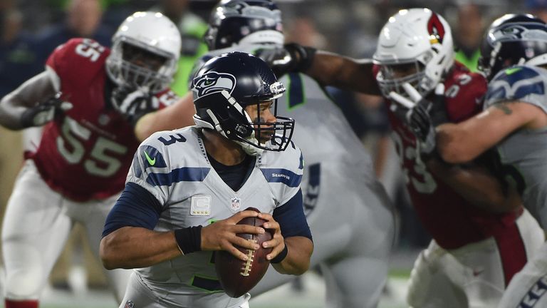 GLENDALE, AZ - OCTOBER 23:  Seattle Seahawks quarterback Russell Wilson #3 drops back to make a pass in the first half of the NFL game against the Arizona 
