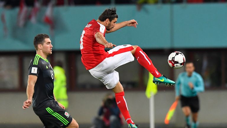 Austria's Aleksandar Dragovic (R) vies with Sam Vokes of Wales during their World Cup qualifier 