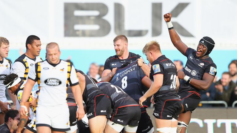 BARNET, ENGLAND - OCTOBER 09:  Maro Itoje (R) of Saracens celebrates a try scored by Jamie George (blocked), his second of the match during the Aviva Premi