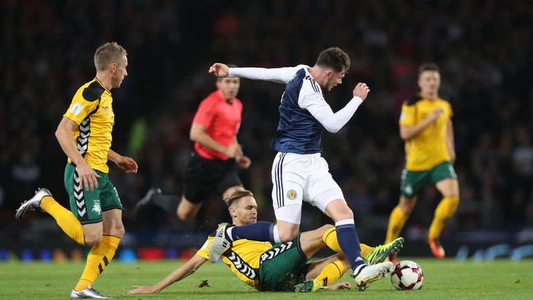 Arturas Zulpa of Lithuania vies with Oliver Burke of Scotland during the FIFA 2018 World Cup Qualifier between Scotland and Lithuania