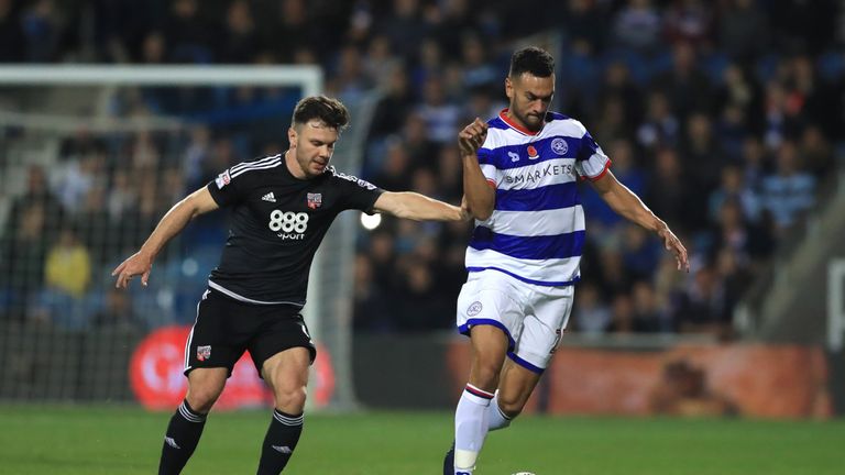 Queens Park Rangers' Steven Caulker battles for possession of the ball with Brentford's Scott Hogan during the Sky Bet Championship match at Loftus Road, L