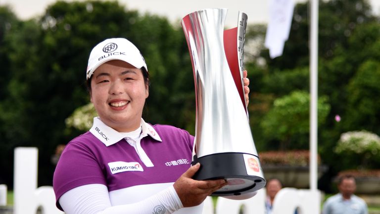 KUALA LUMPUR, MALAYSIA - OCTOBER 30:  Shanshan Feng of China poses with the Sime Darby LPGA trophy after she won it 17 under par 267  during day four of th