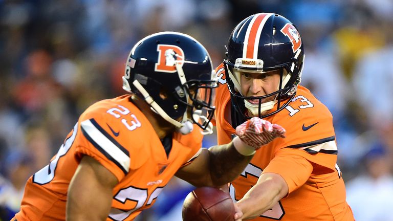 SAN DIEGO, CA - OCTOBER 13: Trevor Siemian #13 of the Denver Broncos hands off to Devontae Booker #23 during the second quarter against the San Diego Charg