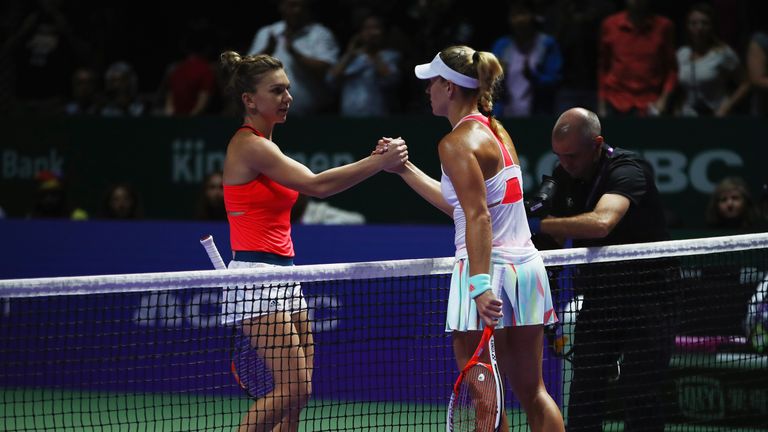 SINGAPORE - OCTOBER 25:  Simona Halep (L) of Romania congratulates Angelique Kerber of Germany after their singles match during day 3 of the BNP Paribas WT