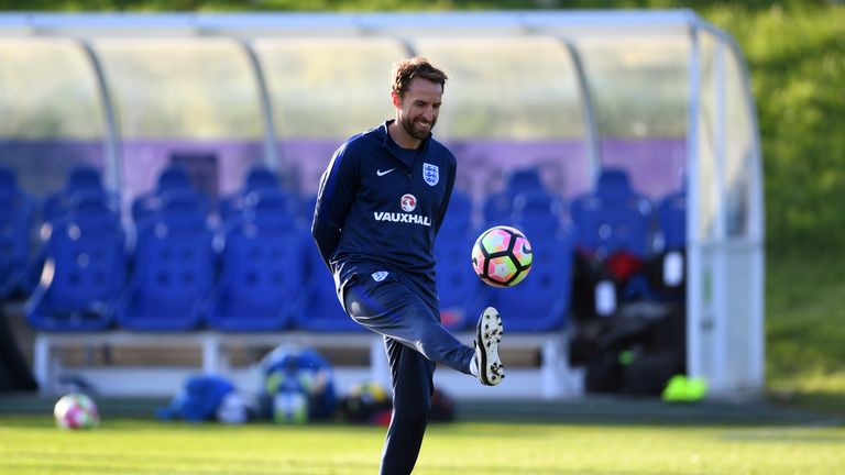 BURTON-UPON-TRENT, ENGLAND - OCTOBER 04:  Interim England manager Gareth Southgate kicks a ball during an England training session at St George's Park on O