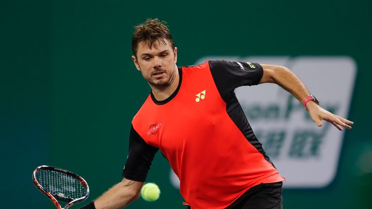 SHANGHAI, CHINA - OCTOBER 13:  Stan Wawrinka of Switzerland returns a shot against Gilles Simon of France during the Men's singles third round match on day