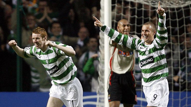 Celtic's midfielder Scottish Stephen Pearson (L) celebrates with his teammate Kenny Miller after scoring the third goal against B