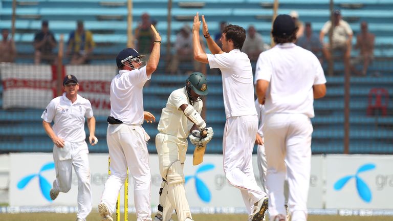 CHITTAGONG, BANGLADESH - MARCH 15:  England bowler Steven Finn takes the wicket of Bangladesh batsman Imrul Kayes during day four of the 1st Test match bet