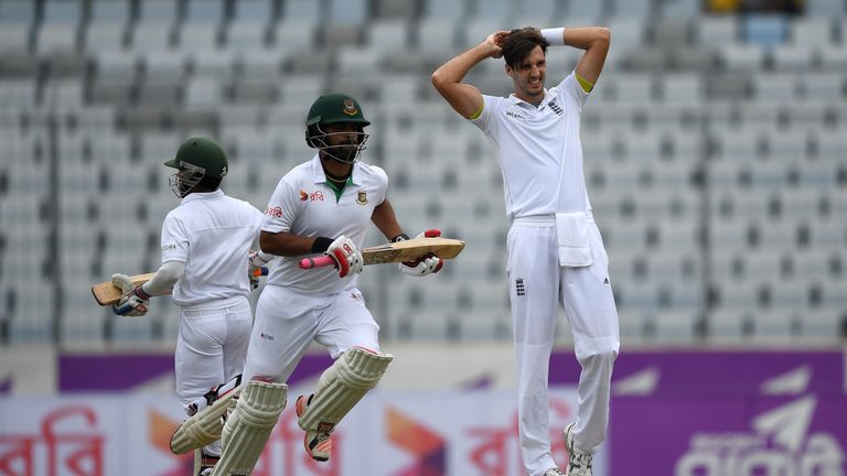 Steven Finn reacts as Tamim Iqbal and Mominul Haque score runs during the first day of the 2nd Test