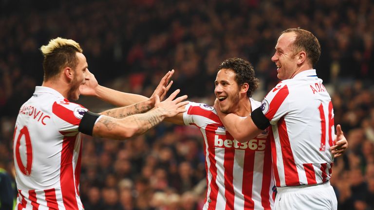 STOKE ON TRENT, ENGLAND - OCTOBER 31:  (L-R) Marko Arnautovic, Ramadan Sobhi and Charlie Adam of Stoke City celebrate as Alfie Mawson of Swansea City (not 