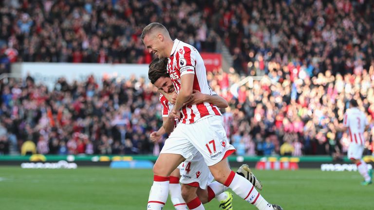 STOKE ON TRENT, ENGLAND - OCTOBER 15: Joe Allen of Stoke City (L) celebrates scoring his sides second goal with his team mate Ryan Shawcross of Stoke City 
