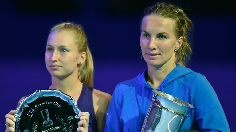 Russia's Svetlana Kuznetsova (R) celebrates with her trophy after defeating Australia's Daria Gavrilova (L) after the Kremlin Cup tennis tournament final m