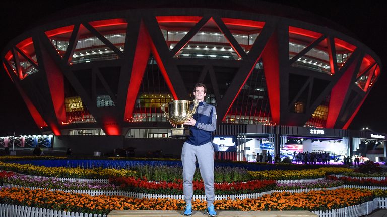 Andy Murray holds the winners trophy after winning the China Open