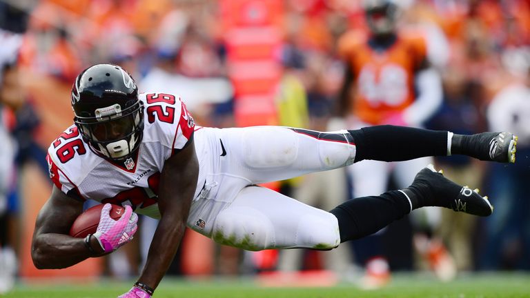 DENVER, CO - OCTOBER 9:  Running back Tevin Coleman #26 of the Atlanta Falcons dives for a touchdown in the third quarter of the game against the Denver Br