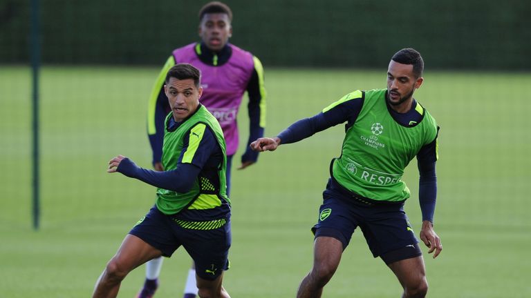 Theo Walcott [right] has been in fine form for Arsenal this season