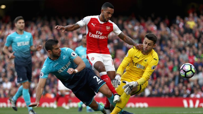 Theo Walcott scores fro Arsenal against Swansea