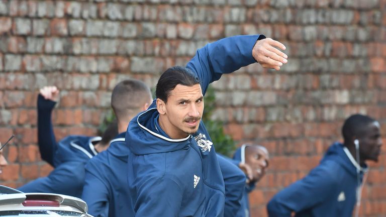 Manchester United squad warm up outside the Titanic Hotel before tonights game against Liverpool