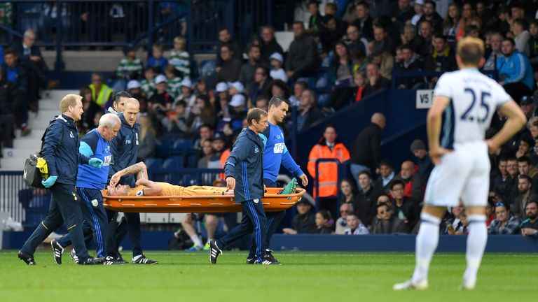 Tottenham defender Toby Alderweireld is stretchered off the pitch during the game at West Brom
