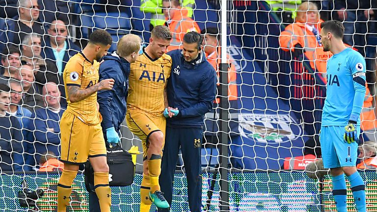 Tottenham defender Toby Alderweireld receives medical attention during the game against West Brom