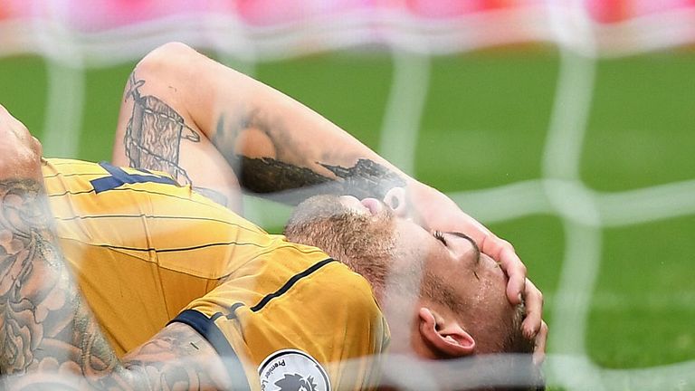WEST BROMWICH, ENGLAND - OCTOBER 15:  Toby Alderweireld of Tottenham Hotspur goes down injured and holding his head during the Premier League match between