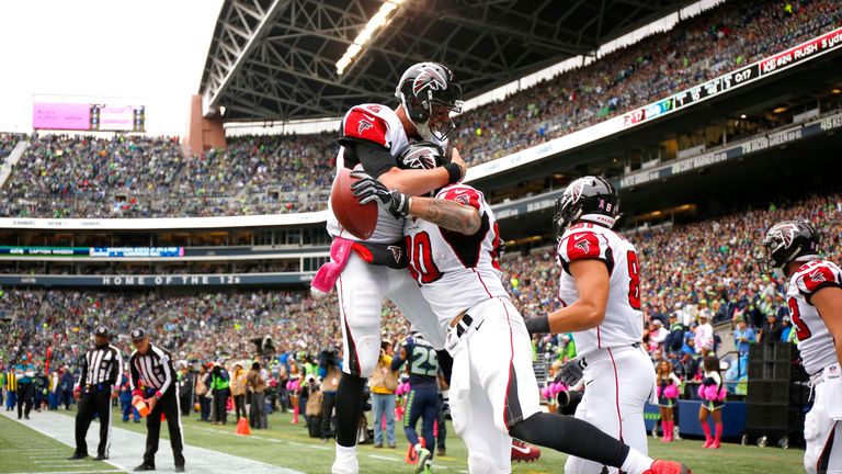 SEATTLE, WA - OCTOBER 16:  Tight end Levine Toilolo #80 of the Atlanta Falcons celebrates his touchdown with Quarterback Matt Ryan #2 against the Seattle S