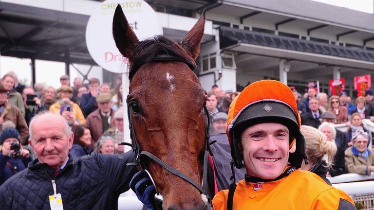 CHEPSTOW, UNITED KINGDOM - OCTOBER 25: Jockey Tom Scuadmore(R) poses with Thistlecrack after winning the Aspen Waite Complete Business Growth Service Novic