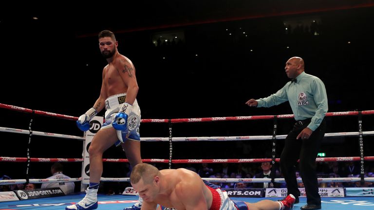 Tony Bellew knocks down BJ Flores for the WBC World cruiserweight title at the Echo Arena, Liverpool.