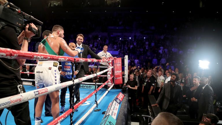 Tony Bellew has a heated exchange with David Haye (right) after victory over BJ Flores for the WBC World cruiserweight title at the Echo Arena, Liverpool.