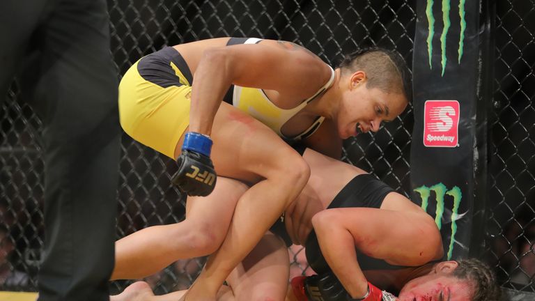 LAS VEGAS, NV - JULY 9: Amanda Nunes punches Miesha Tate (R) during the UFC 200 event at T-Mobile Arena on July 9, 2016 in Las Vegas, Nevada. (Photo by Rey