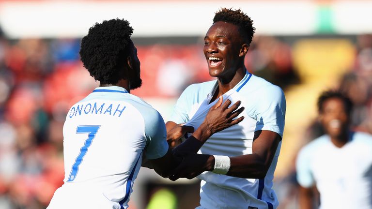 Tammy Abraham celebrates with team-mate Josh Onomah after scoring England's second goal
