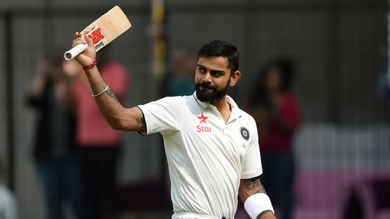 Indian batsman and captain Virat Kohli gestures towards the crowd as he walks back towards pavilion after his dismissal during the second day of third test
