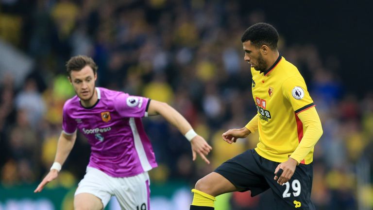 Hull City's Will Keane (left) challenges for the ball with Watford's Etienne Capoue 