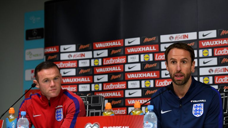 Interim England manager Gareth Southgate speaks next to Wayne Rooney during an England press conference