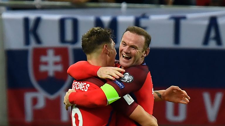 England's forward Wayne Rooney celebrates with England's defender John Stones the winning goal for England during the World Cup 2018 football qualification