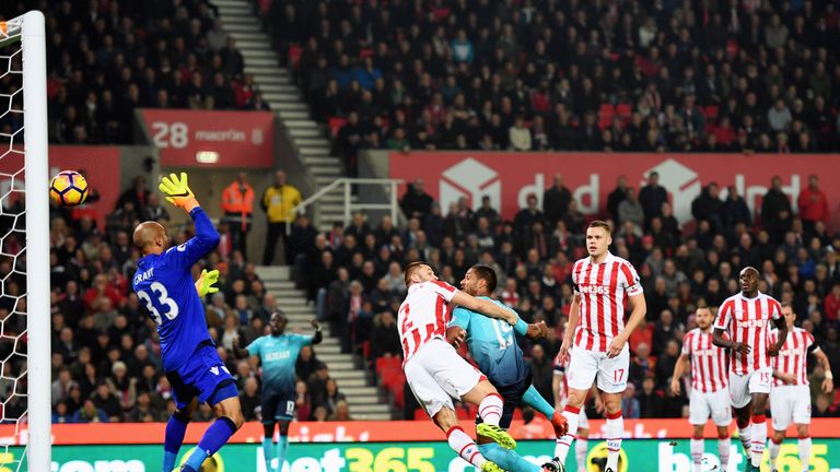 STOKE ON TRENT, ENGLAND - OCTOBER 31:  Wayne Routledge of Swansea City (15) beats Phil Bardsley of Stoke City (2) to score their first goal past goalkeeper